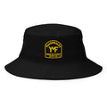 YMF Farm-to-Closet Bucket Hat — black organic cotton twill with gold MacDonald's Farm-to-Closet Supply Co. crest, front view