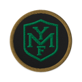 YMF Embroidered Patch — 3-inch round patch with green YMF shield monogram on black with gold rope border